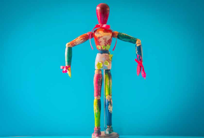 selective focus photo of multicolored wooden mannequin